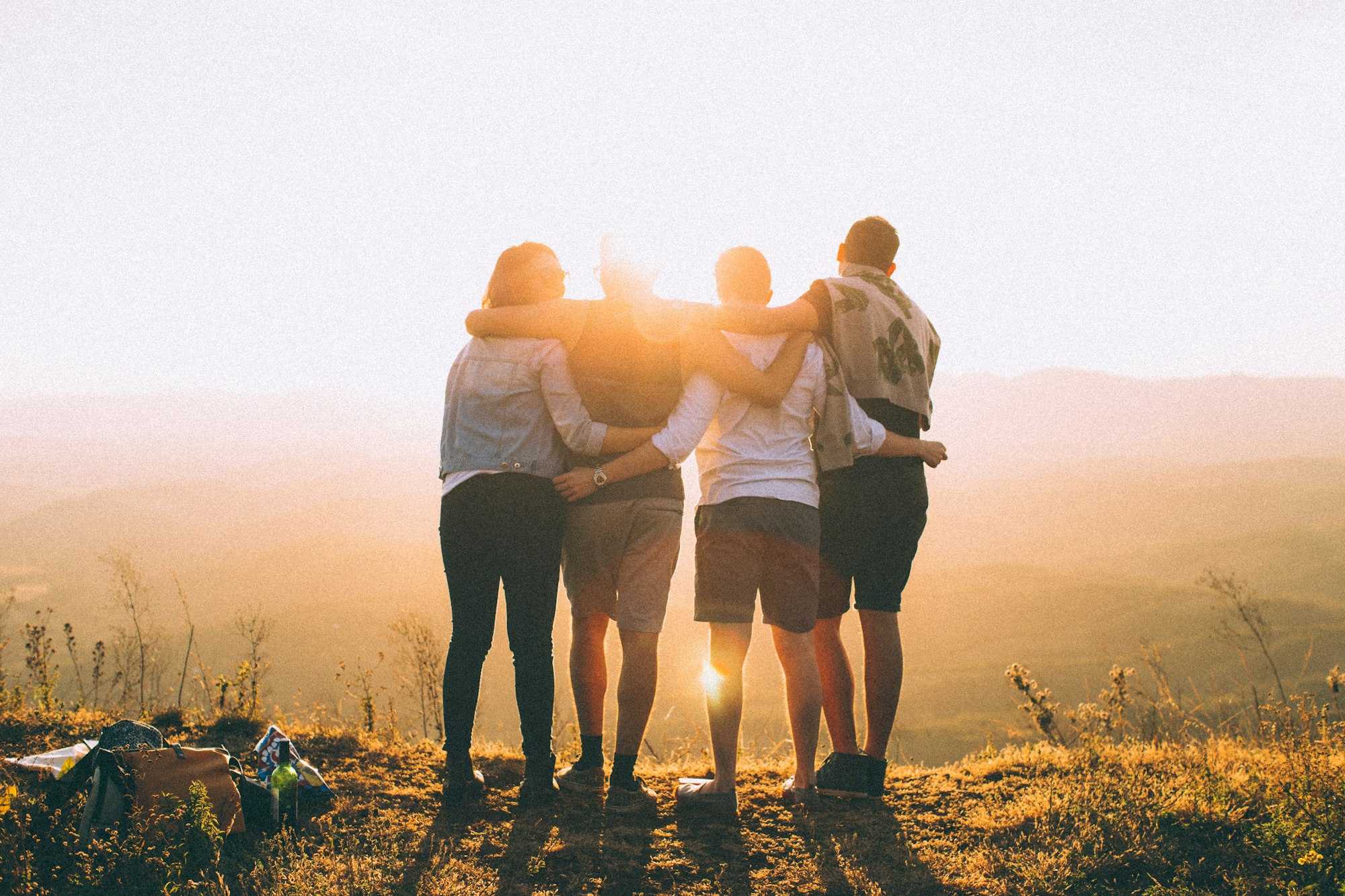 Friends together at sunrise